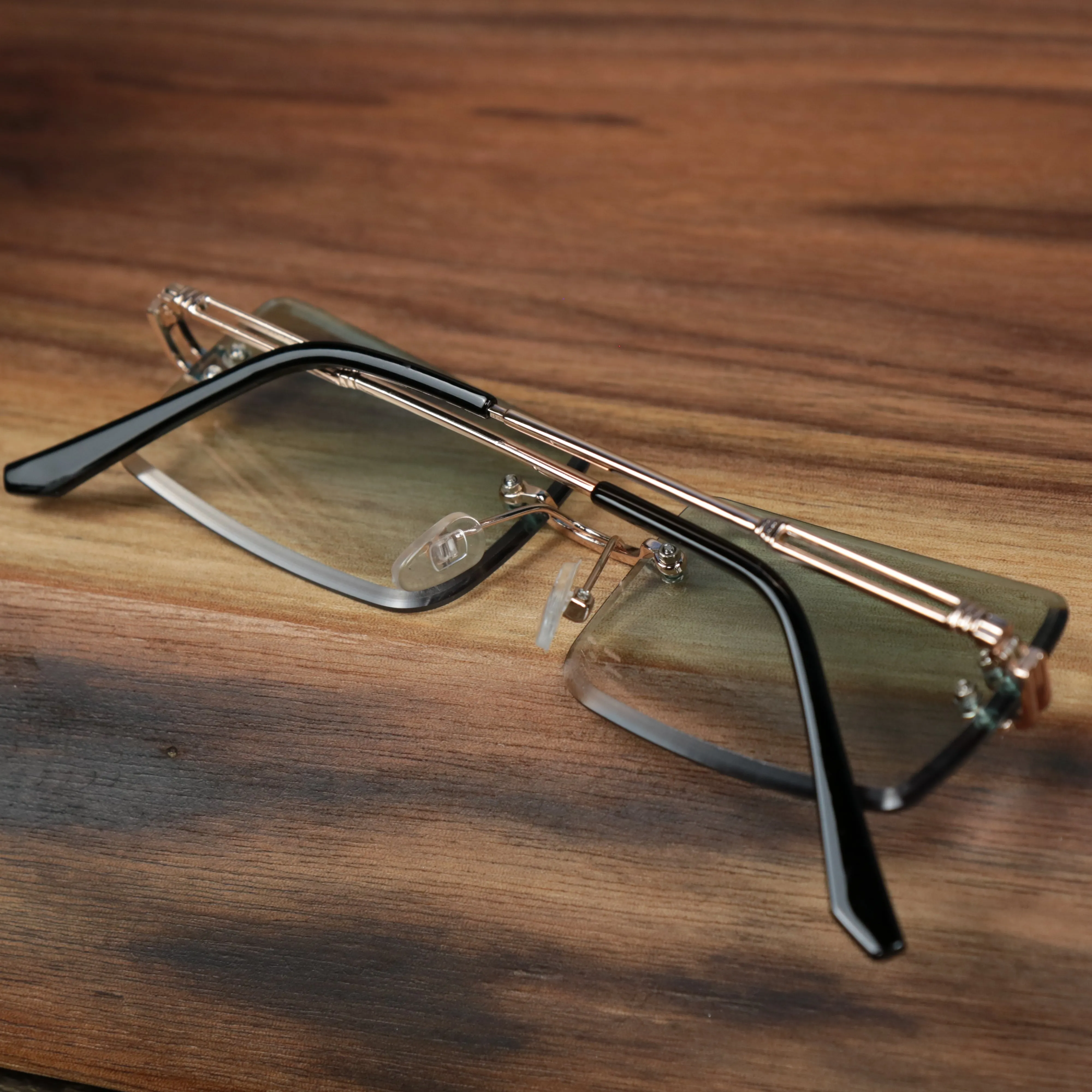 Green Lens Rectangle Frame Sunglasses with Gold Frame.