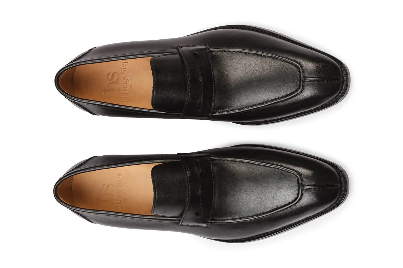 Penny loafer featuring hand cording on the vamp, toe, and back counter.