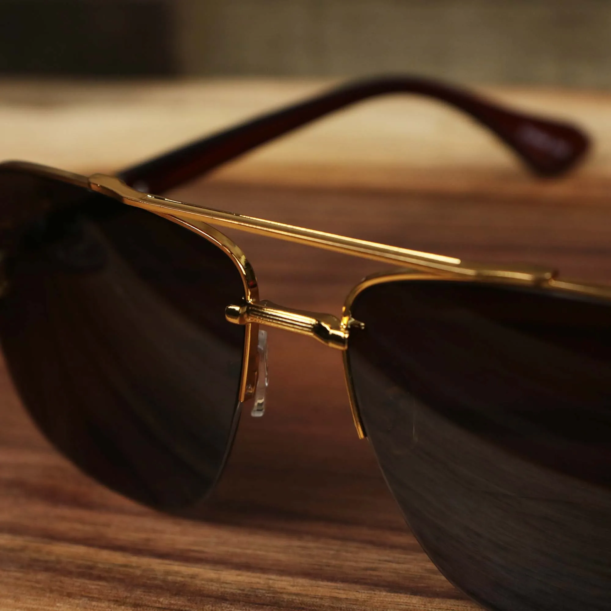 Round Brown Lens Sunglasses with Gold Frame.