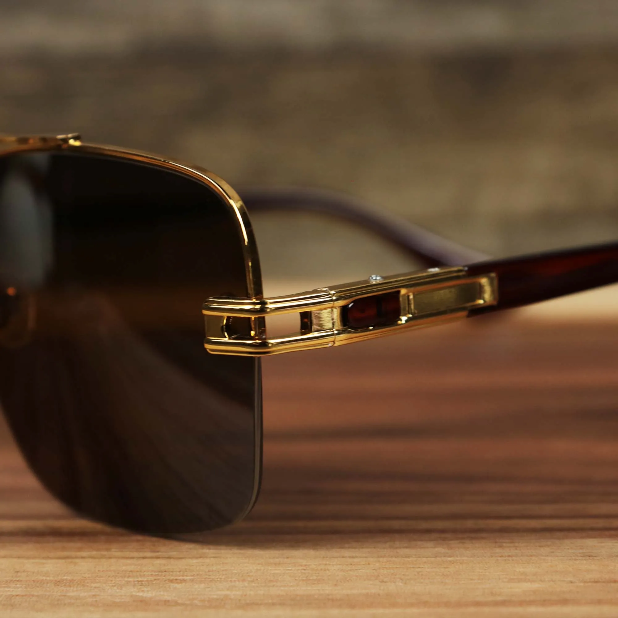 Round Brown Lens Sunglasses with Gold Frame.