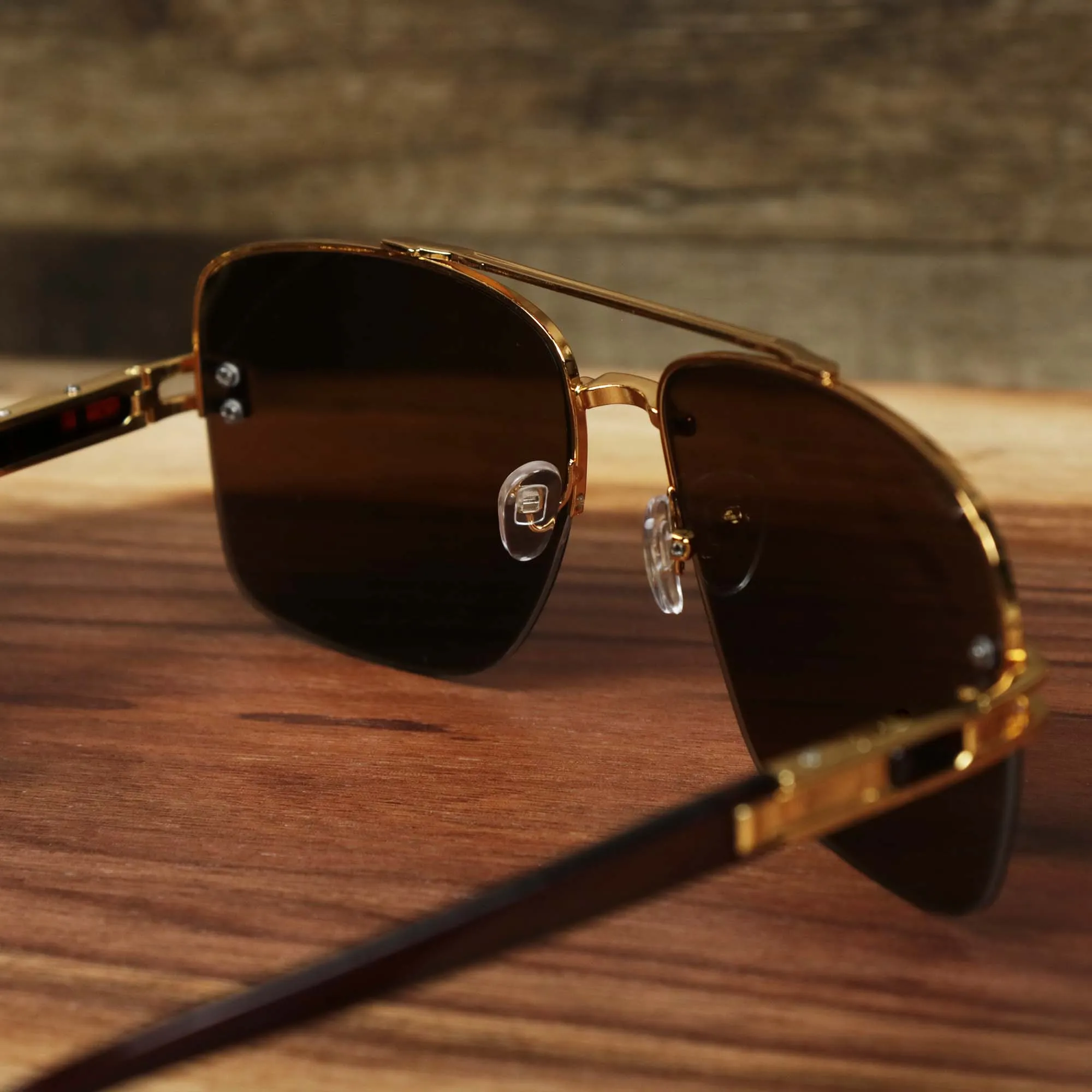 Round Brown Lens Sunglasses with Gold Frame.